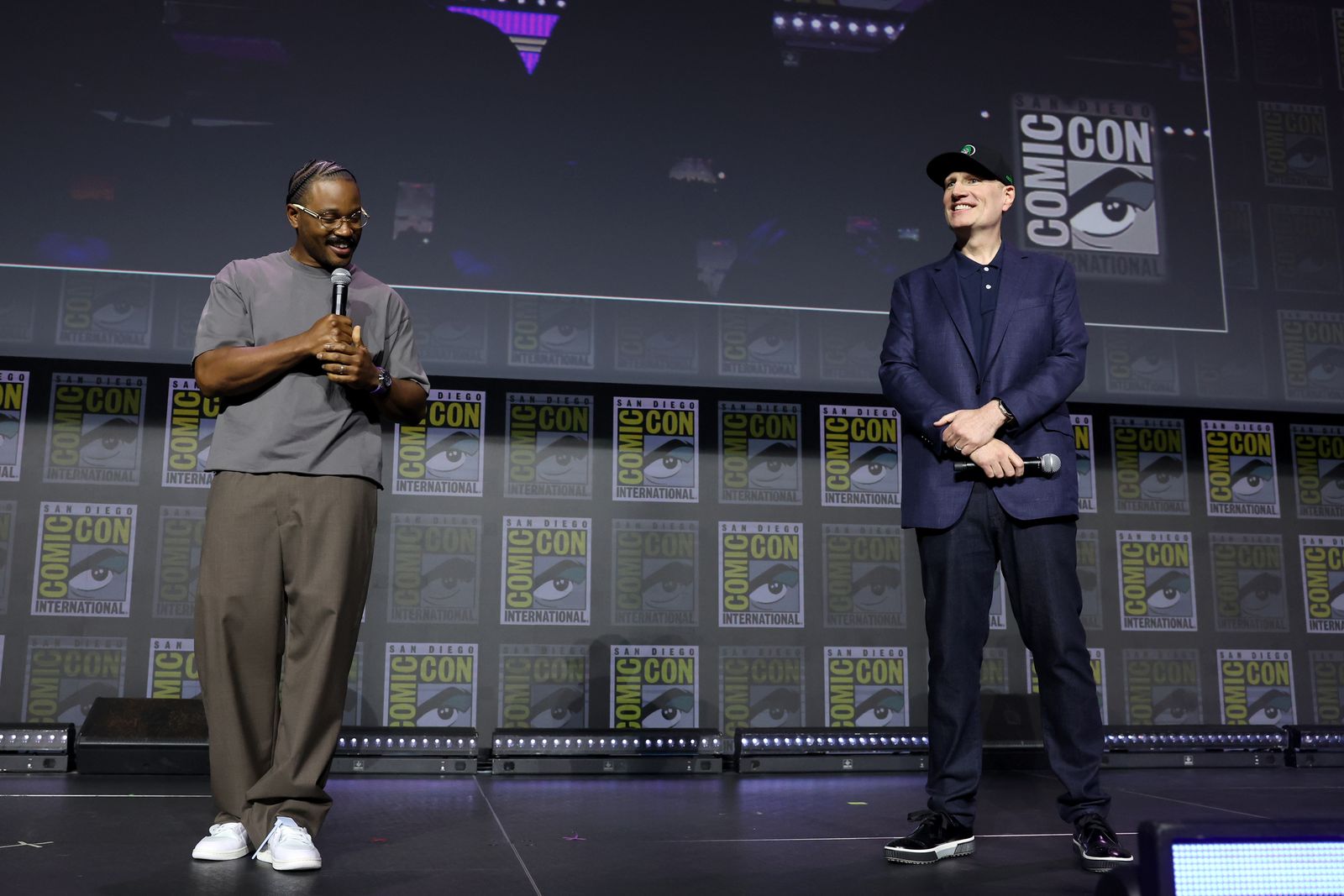 Image may contain Kevin Feige Crowd Person Adult Accessories Glasses Wristwatch and Audience
