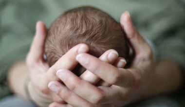 baby head in hands