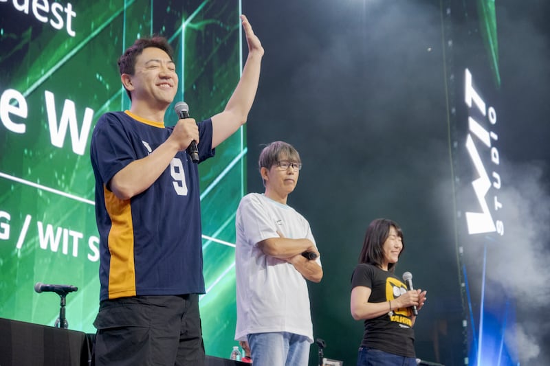 People on stage presenting a panel