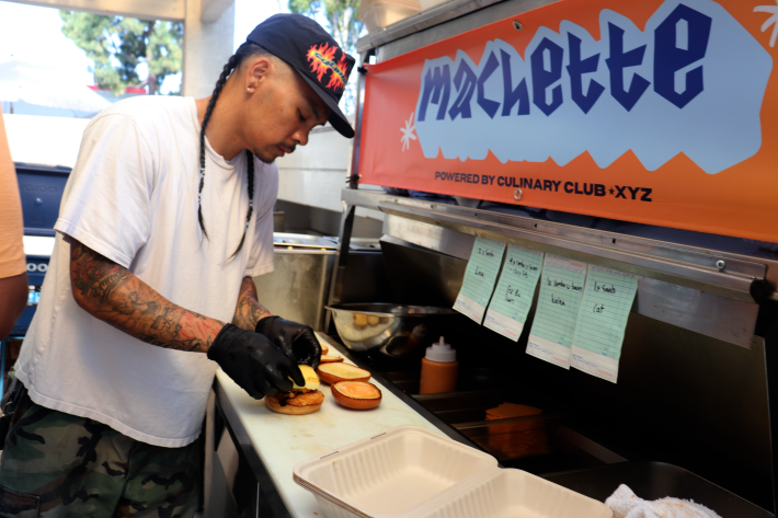 a man prepares a sandwich