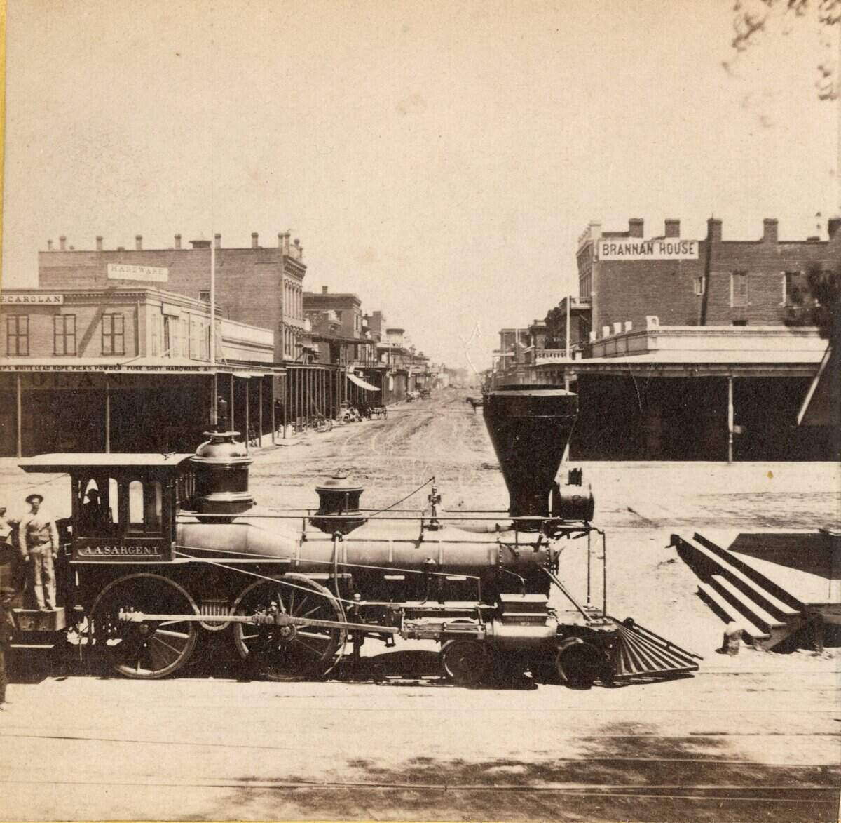 Alfred A. Hart, the railroad's official photographer, recorded the progress of the railway from Sacramento, over the Sierra Nevada range, across Nevada to Promontory, Utah, using a 5-by-8 inch wet-plate stereo camera and processing his fragile glass plates in a portable dark tent. J Street, Sacramento City. View from the Levee.