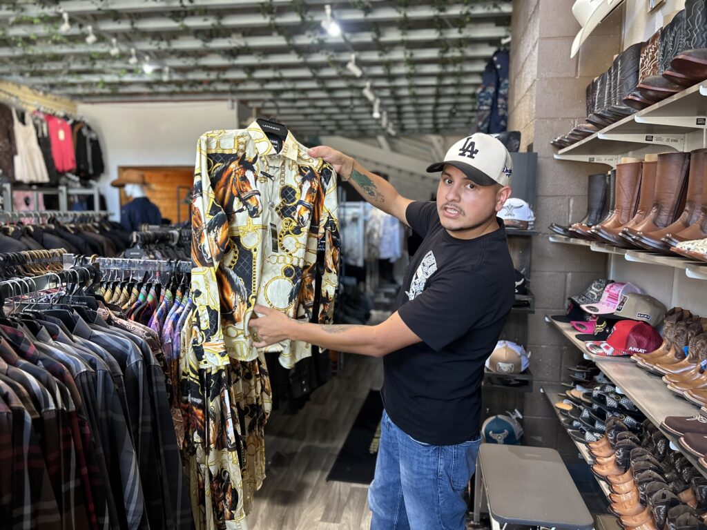 Man showing his western wear shirts