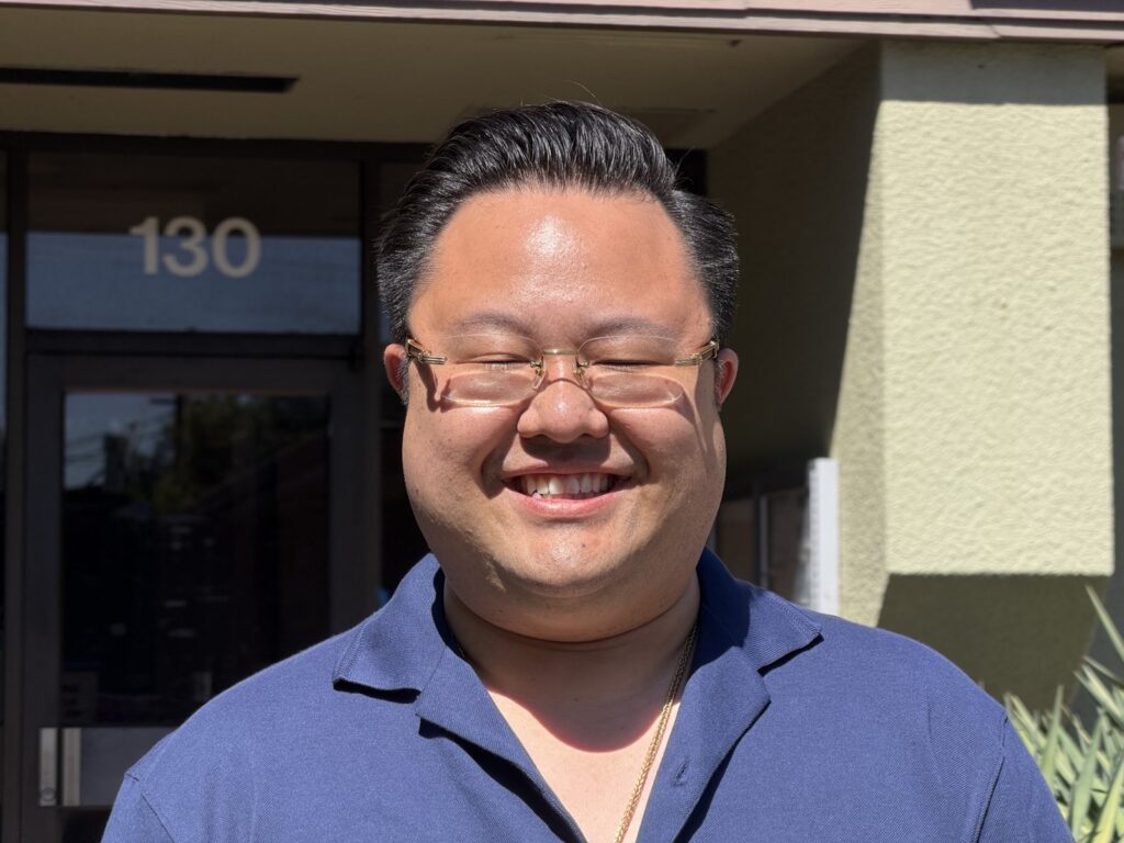 A smiling man.