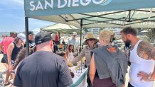 A San Diego city park ranger meet with visitors on Friday to educate them on marine animals and the law, July 24, 2026.