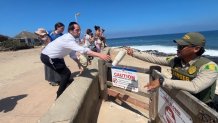 A San Diego park ranger recovered a water bottle dropped by a family into the protected area of sea lions, Thursday, La Jolla, Calif., July 30, 2026.