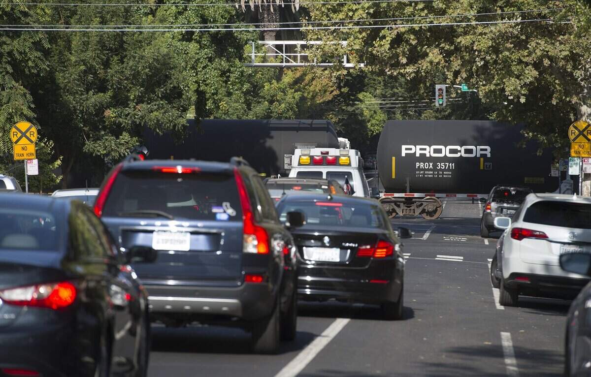 A BNSF Railway freight train on the train tracks which parallel 19th Street during the morning commute in midtown on Tuesday, September 13, 2016 in Sacramento.