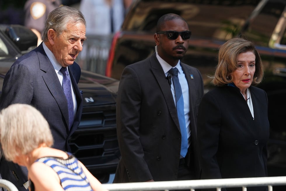 Rep. Nancy Pelosi, D-Calif., and her husband Paul arrive at the funeral services for Clive...