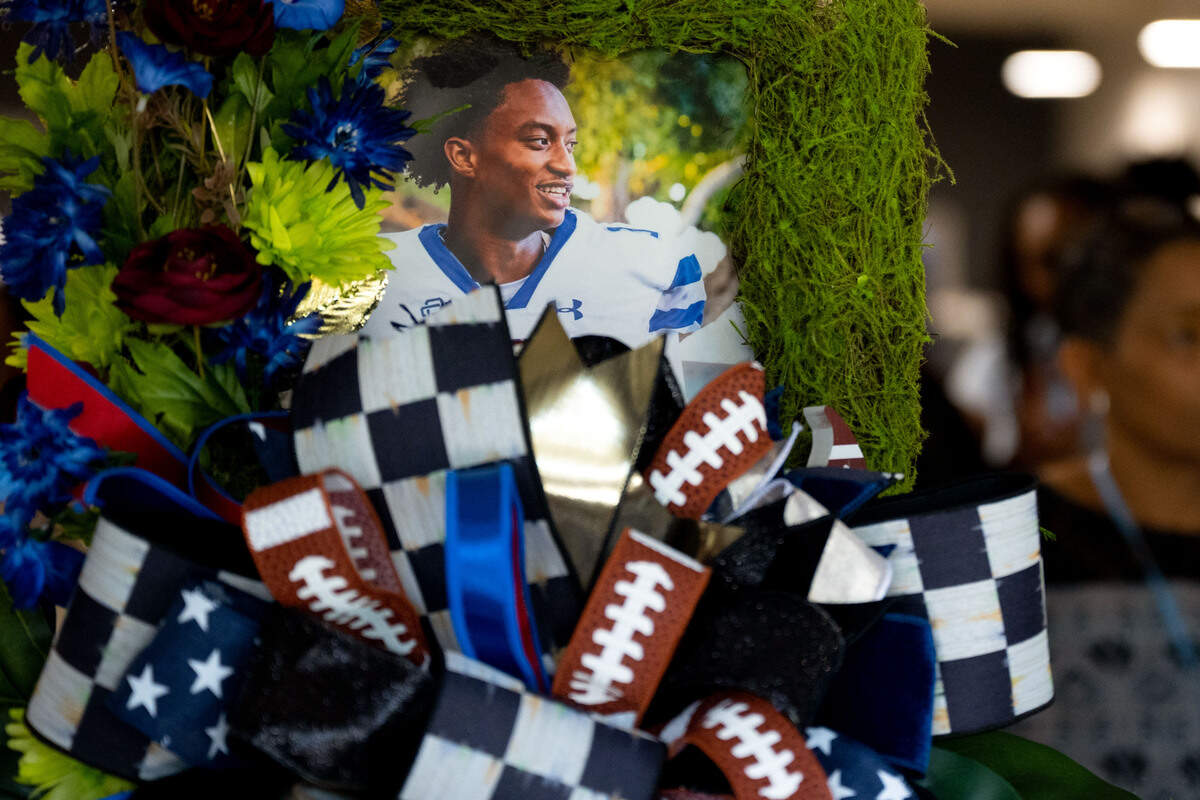 A framed picture of Nolan Wells is placed at the entrance to Center Pointe Church during the teen’s funeral service on July 20.