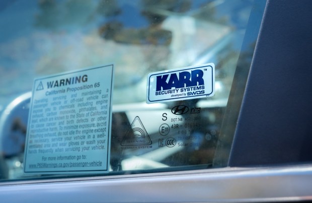 This sticker, found on cars sold after 2017 on the driver's side window, indicates that the vehicle likely has had a vulnerable system installed by a dealer. (David Baillot/University of California San Diego/Jacobs School of Engineering)