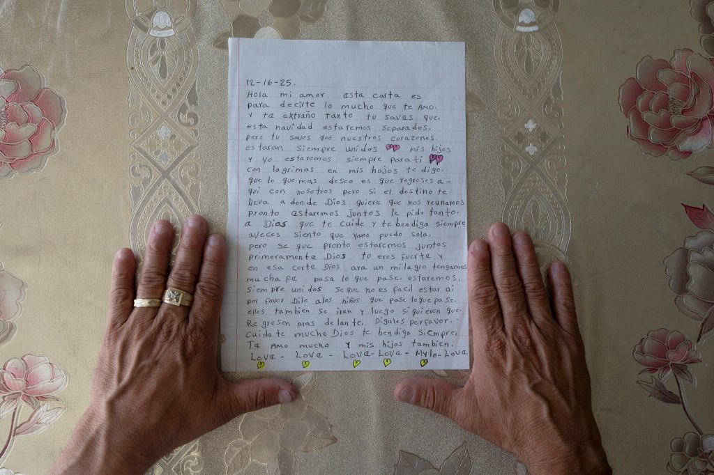 Giovanni shares a letter his wife, Maria, sent him while he was in detention. Photo: Karla Gachet for Capital & Main.