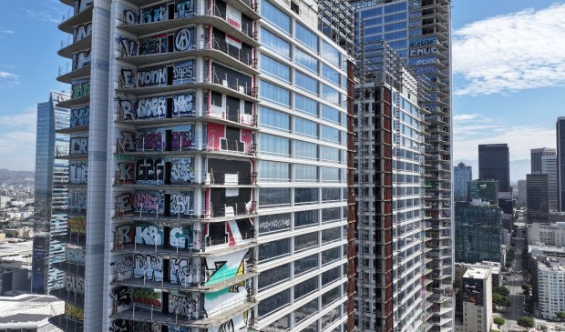 A U.S. Bankruptcy Court judge has cleared the path for sale of the abandoned graffiti-covered development in downtown L-A -- popularly known as the Graffiti Towers. The ruling happened because of the withdrawal of objections by both the city of Los Angeles and Los Angeles County during a hearing on Monday.  The site across from the Los Angeles Convention Center is seen on Tuesday, July 21, 2026.  (Photo by Dean Musgrove, Los Angeles Daily News/SCNG)