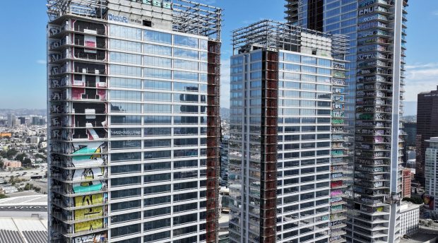A U.S. Bankruptcy Court judge has cleared the path for sale of the abandoned graffiti-covered development in downtown L-A -- popularly known as the Graffiti Towers. The ruling happened because of the withdrawal of objections by both the city of Los Angeles and Los Angeles County during a hearing on Monday.  The site across from the Los Angeles Convention Center is seen on Tuesday, July 21, 2026.  (Photo by Dean Musgrove, Los Angeles Daily News/SCNG)