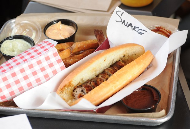 The rattle snake hot dog at Wurstkuche is one of the most exotic dogs served at the downtown Los Angeles restaurant. (photo by John McCoy/Los Angeles Daily News)
