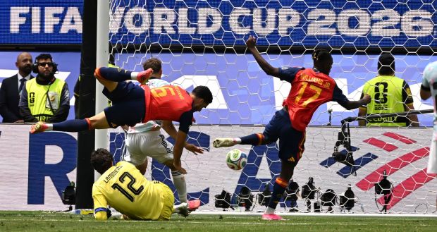 Spain midfielder Mikel Merino (6) scores past Belgium goalkeeper Senne Lammens (12) late in the second half of their World Cup quarterfinal on Friday. (Photo by Keith Birmingham, Pasadena Star-News/ SCNG)