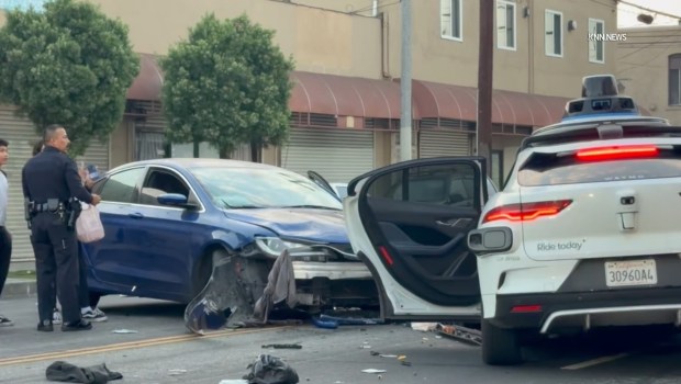 A crash involving a Waymo autonomous vehicle and another car on Sunday in Los Angeles' Pico-Union neighborhood sent two people to the hospital, according to a videographer's report from the scene. One of the patients was in critical condition. (Photo from video by Jose Gomez/Key News Network)