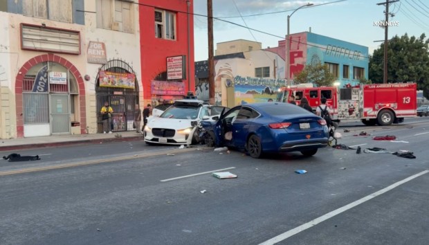 A crash involving a Waymo autonomous vehicle and another car on Sunday in Los Angeles' Pico-Union neighborhood sent two people to the hospital, according to a videographer's report from the scene. One of the patients was in critical condition. (Photo from video by Jose Gomez/Key News Network)