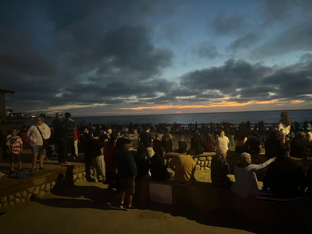 A large crowd of people await the 2026 La Jolla Sky Show in La Jolla Shores. (Noah Lyons)