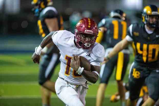 Wilson's Jemel Grigsby runs for a touchdown against Millikan at Millikan High School on Friday, Sept. 26, 2025. (Photo by Scott Smeltzer/Contributing Photographer)
