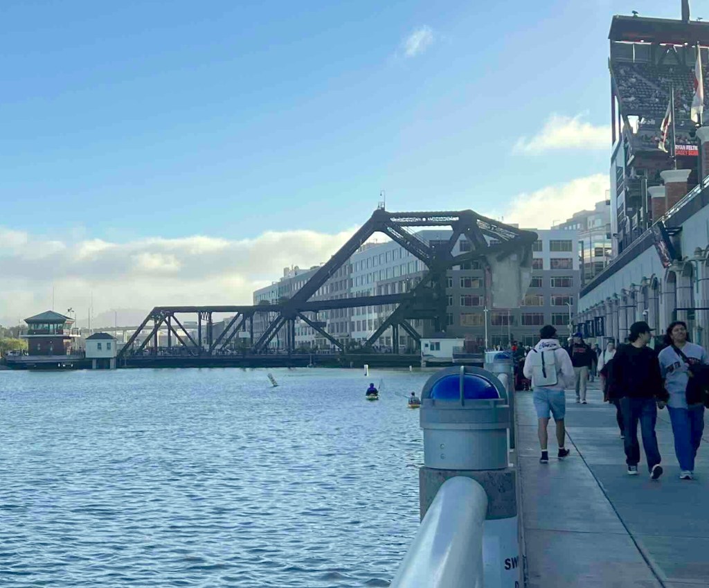 A steel bridge spanning a body of water.