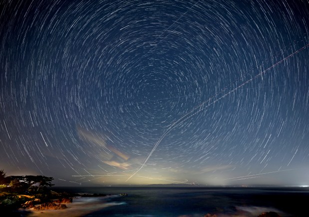Because of the Earth's rotation, layered exposures of the stars appear to circle Polaris, the North Star, at Berwick Park in Pacific Grove, Calif., on Tuesday, May, 19, 2026. (Doug Duran/Bay Area News Group)