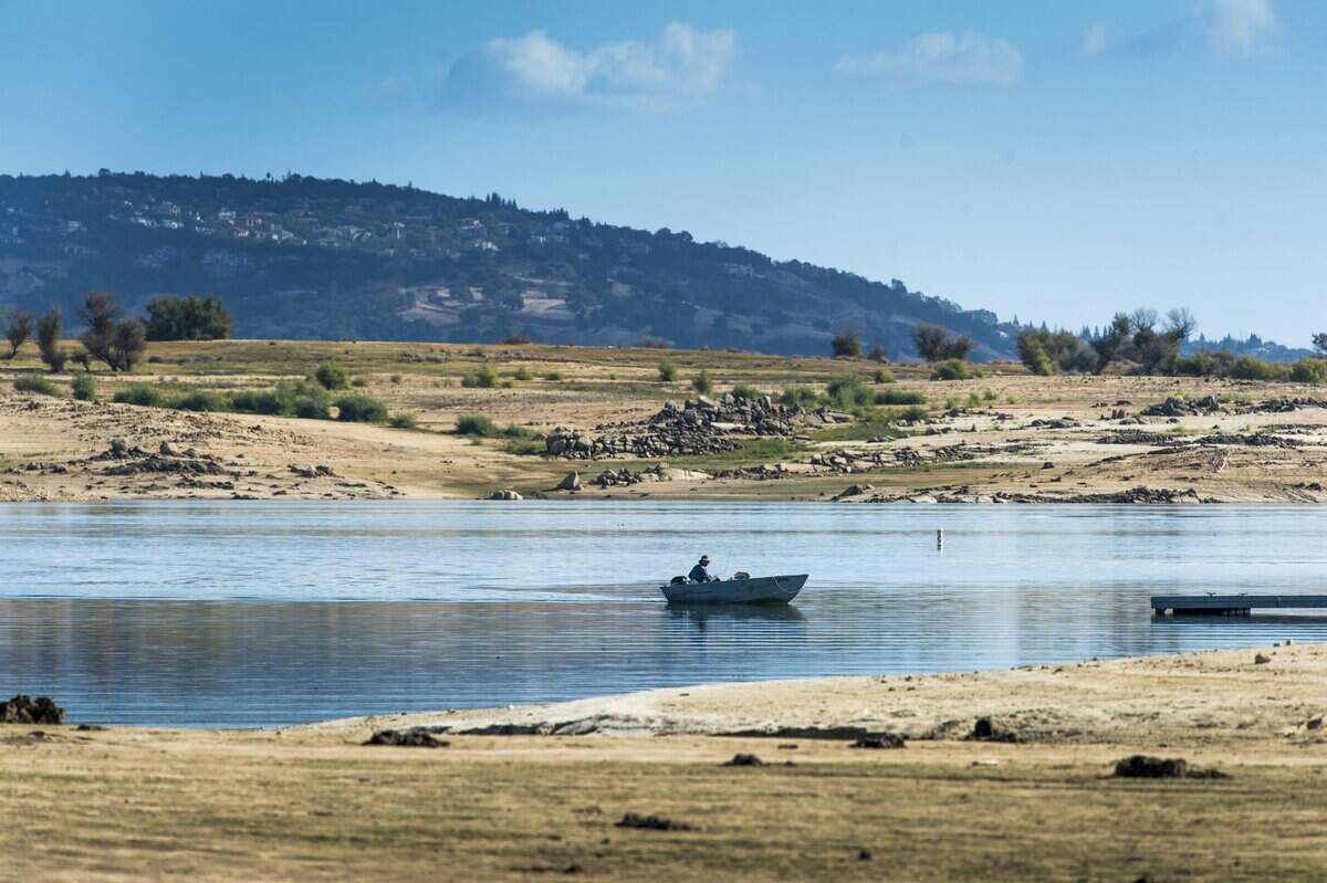 A boater navigates Folsom Lake in 2016, after the year’s so-called “Godzilla” El Niño didn’t produce enough rainfall to end a drought.