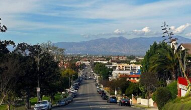 a scene of a street and mountains