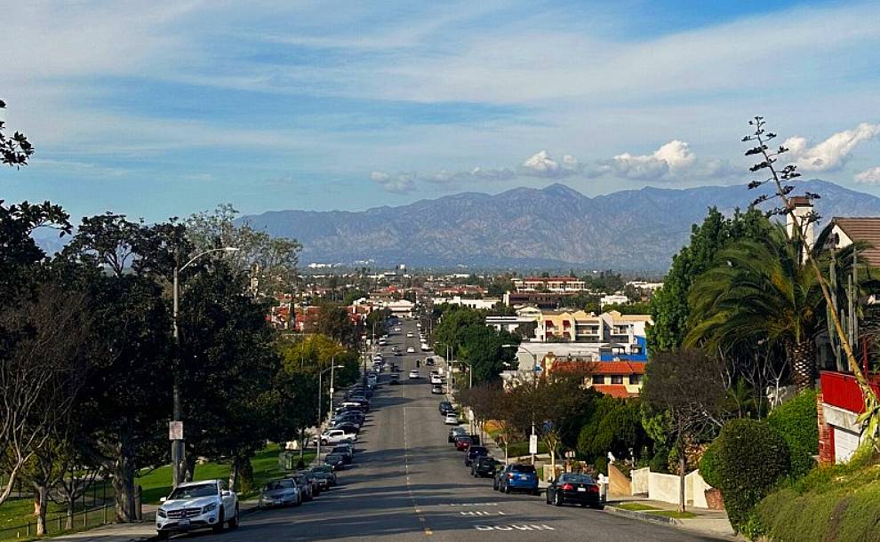 a scene of a street and mountains
