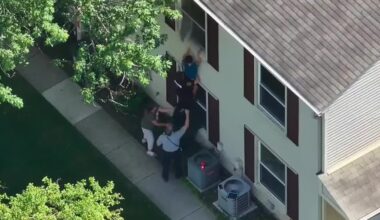 Deputy rescues 2 children from second-story window during Oakland County house fire