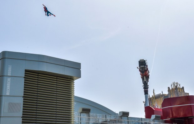A stuntronic audio-animatronic Spider-Man is flung across the top of the Web Slingers: A Spider-Man Adventure attraction at Avengers Campus inside Disney California Adventure in Anaheim, CA, on Wednesday, June 2, 2021. (Photo by Jeff Gritchen, Orange County Register/SCNG)