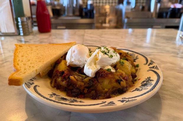 Pastrami Hash with Poached Eggs at Max & Helens. (Benjamin Royer, SCNG)