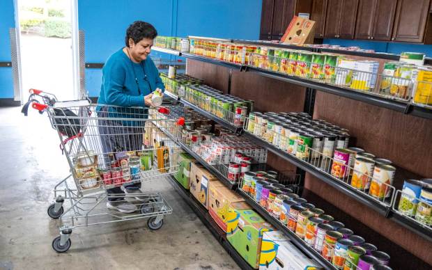 A Lake Forest woman shops for groceries at South County Outreach, a food distribution center, in Irvine on Friday, February 24, 2023. The additional emergency money CalFresh recipients were receiving as part of pandemic assistance is ending, meaning many OC residents will have less money to spend on feeding families. (Photo by Mark Rightmire, Orange County Register/SCNG)
