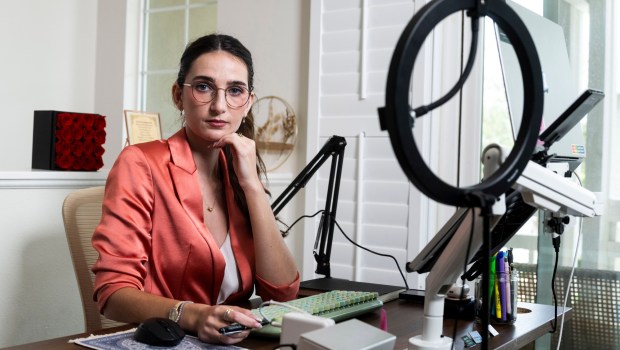 Cheyenne Hunt, founder and executive director of Reckoning Action, works at home in Orange County on Monday, July 13, 2026. (Photo by Paul Bersebach, Orange County Register/SCNG)