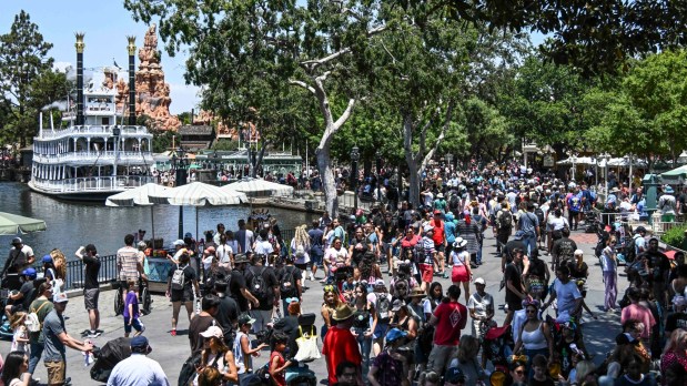 Mark Twain Riverboat and the spire of Big Thunder Mountain Railroad at Frontierland as crowds pack the area in front of Pirates of the Caribbean at New Orleans Square inside Disneyland at the Disneyland Resort in Anaheim, CA, in 2024. (Photo by Jeff Gritchen, Orange County Register/SCNG)