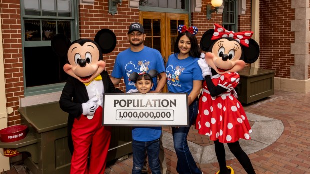 Andres Robles, 8, of Arizona, and his parents Alejandra and Jose are joined by Mickey Mouse and Minnie Mouse after Andres became the 1 billionth visitor to the Disneyland resort. (Courtesy of Disneyland)