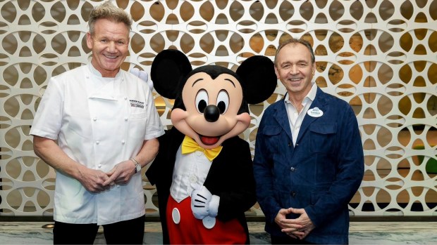 "Hell's Kitchen" celebrity chef Gordon Ramsay, left, with Mickey Mouse and then-Disneyland resort president Thomas Mazloum in Downtown Disney in January 2026. (Via Mazloum's Instagram account)
