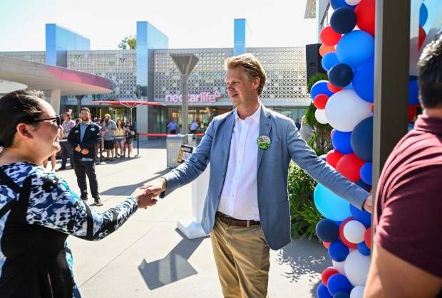 Luke Montagu, 12th Earl of Sandwich, center, greets visitors to the new Earl of Sandwhich at Downtown Disney in Anaheim, CA, on Wednesday, July 15, 2026. (Photo by Jeff Gritchen, Orange County Register/SCNG)