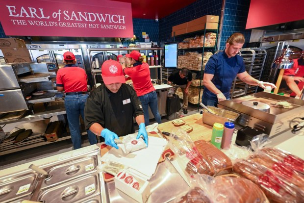 Workers prepare food during the opening of Earl of Sandwhich at Downtown Disney in Anaheim, CA, on Wednesday, July 15, 2026. (Photo by Jeff Gritchen, Orange County Register/SCNG)
