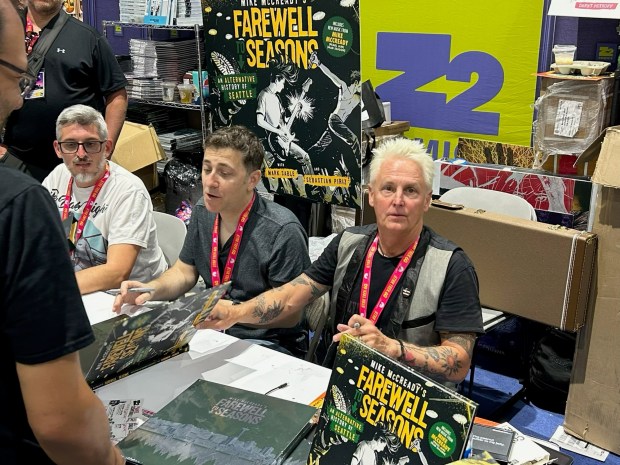 Sebastián Piriz, Marc Sable and Pearl Jam's Mike McCready signing at the Z2 Comics book at San Diego Comic-Con on July 23, 2026. (Photo by Peter Larsen/SCNG)