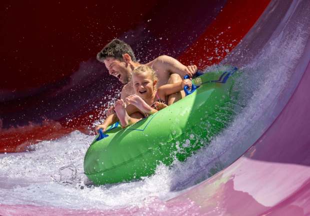 Rob Irwin of Tustin rides Pelican Plunge with his daughter, Evelyn Irwin, 7, at Wild Rivers Waterpark in Irvine on Saturday, July 18, 2026. (Photo by Jeff Antenore, Orange County Register/SCNG)