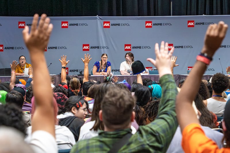 Panelists and a crowd