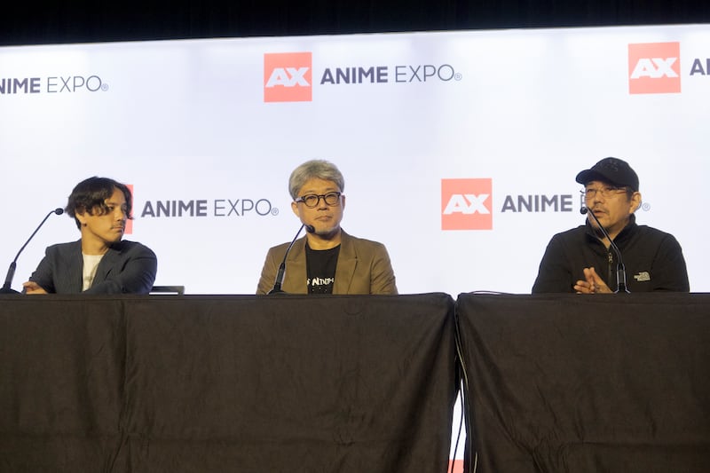 Panelists speaking at a convention