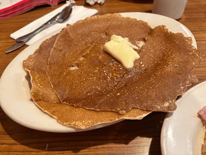a skinny pancake with a pad of butter