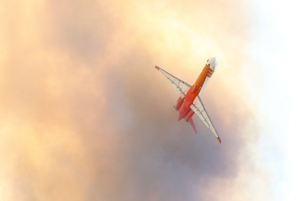 A CalFire plane flying over the Creelman fire in Ramona on July 22, 2026. (Stephanie Ogilvie)