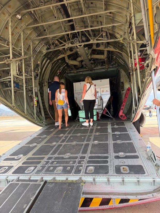 With the back of the C-130H air tanker open, the container holding fire retardant is visible, as it takes up most of the space. Visitors to the Ramona Air Attack Base grand reopening on Monday were able to tour the aircraft and interview pilots and staff. (Regina Elling)