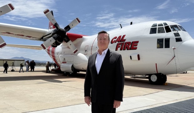 County Supervisor Joel Anderson with the C-130H air tanker in the background. (Regina Elling)