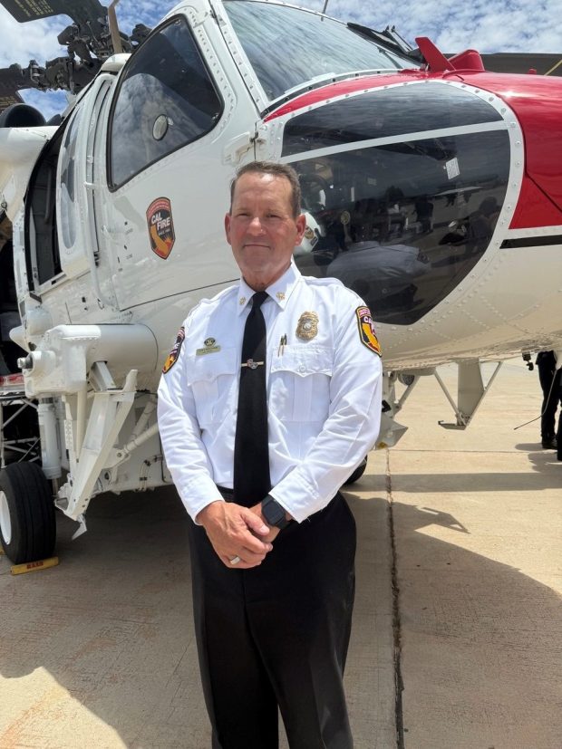CalFire San Diego County Chief Tony Mecham with the Sikorsky S-70 CalFire Hawk. (Regina Elling)