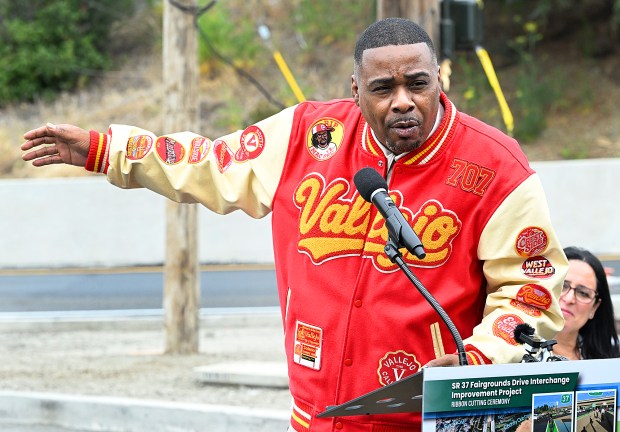 Jamal Rocker, Vallejo rapper Mac Mall, talks about the importance of involving the community during a ribbon-cutting ceremony for the Drive Diverging Diamond Interchange at Fairgrounds Drive and Hwy 37 in Vallejo on Tuesday. (Chris Riley/Times-Herald)