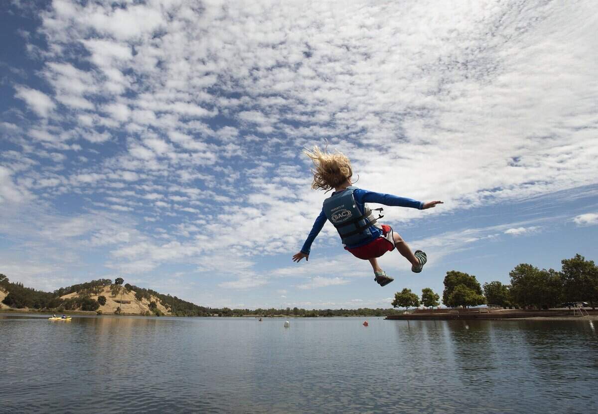 Makenna Hillyard, 9, of Oakland flies over the water at the Sacramento State Aquatic Center at Lake Natoma on June 17, 2016, in Sacramento County.