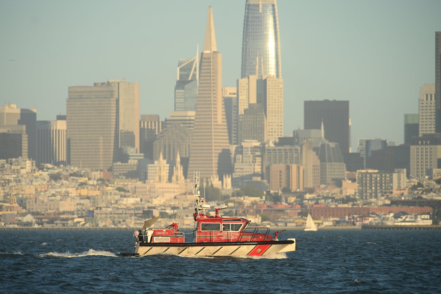 A Southern Marin Fire vessel passes the San Francisco city skyline while searching for missing victims.