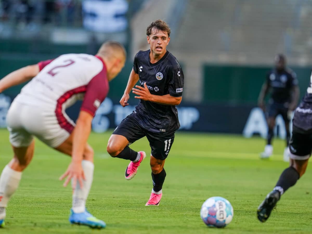 Alameda Post - An Oakland Roots player goes for the ball in the match against Sacramento Republic F.C.